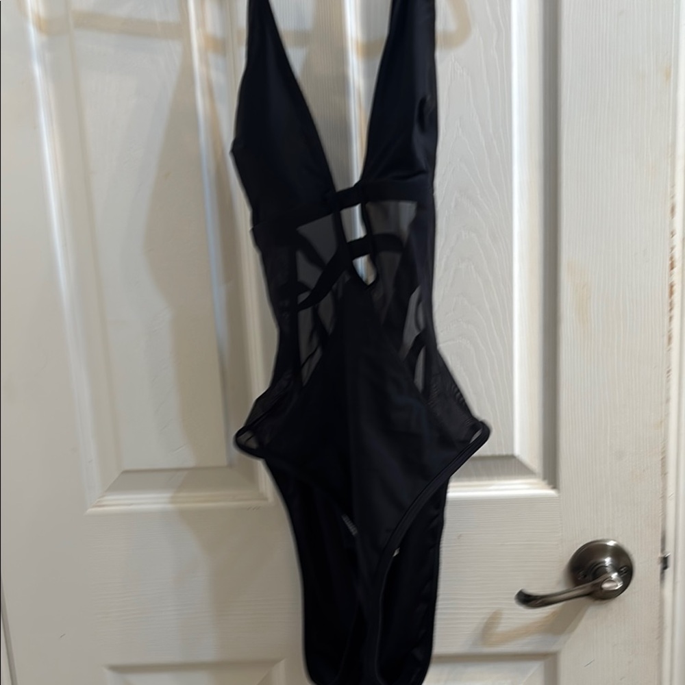 Cupshe with Mesh tummy, she’s padded with two adjustable straps in the back